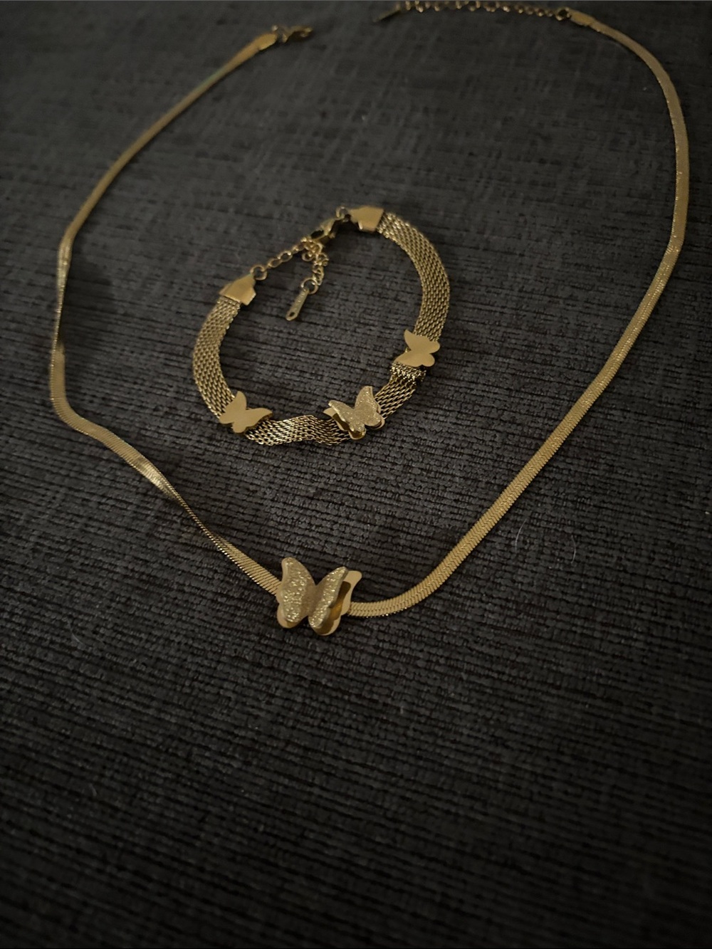 Gold tone butterfly necklace with matching bracelet